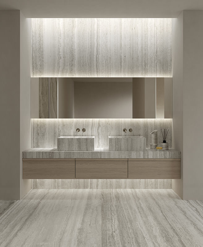 Two stone basins on a timber vanity, with matching stone on the wall and floor